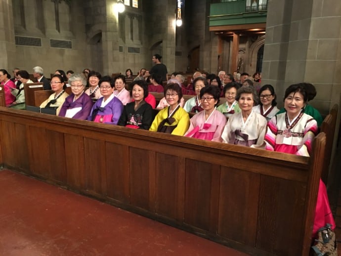 members of the Asian centre in pews